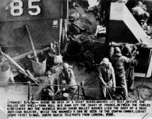 (details) LCI(L)-85 docks along another ship to transfer its survivors, after it was hit by German fire in front of Omaha Beach on "Day-J",