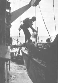 (details) A LCVP is attached to the bosses of an LSI or LST transport