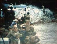 Still in front of the wall, an LCI disembarks troops from the 2nd Infantry Division on 8 or 9 June.