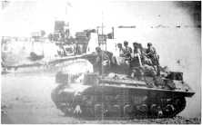 (detail) Arrival of the 2nd DBUS at the Ruquet, a Command-Car with its trailer, around June 10 (detail) A tank-destroyer passes in front of an LCT Mark 6